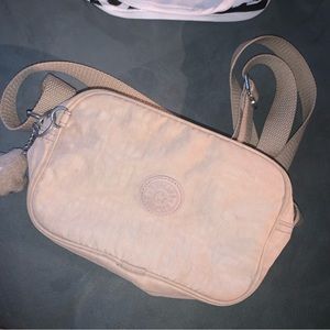 Kipling light beige cross body camera bag